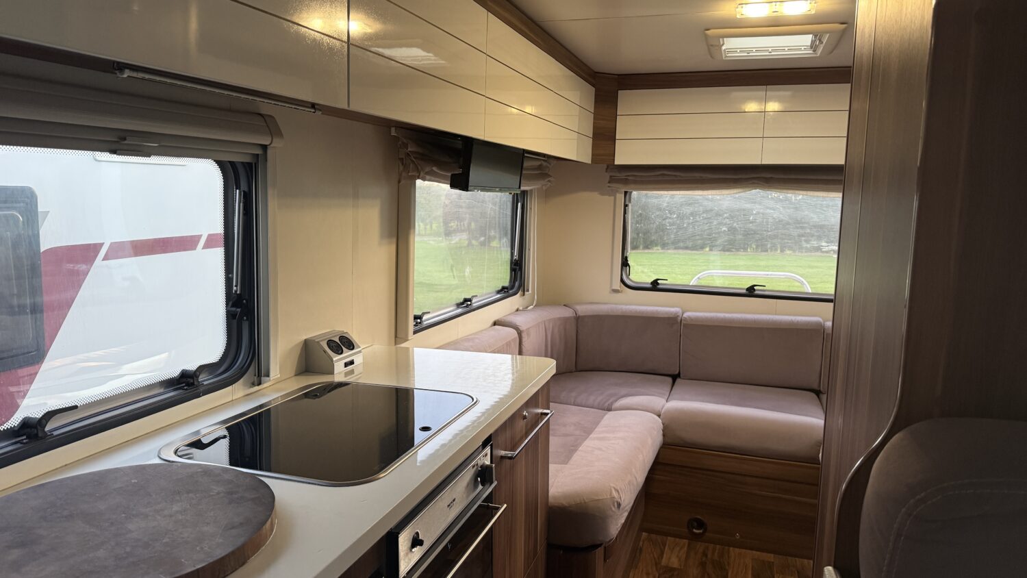 Rosy 6 berth campervan rental in New Zealand with bike rack, awning and spacious family motorhome layout.