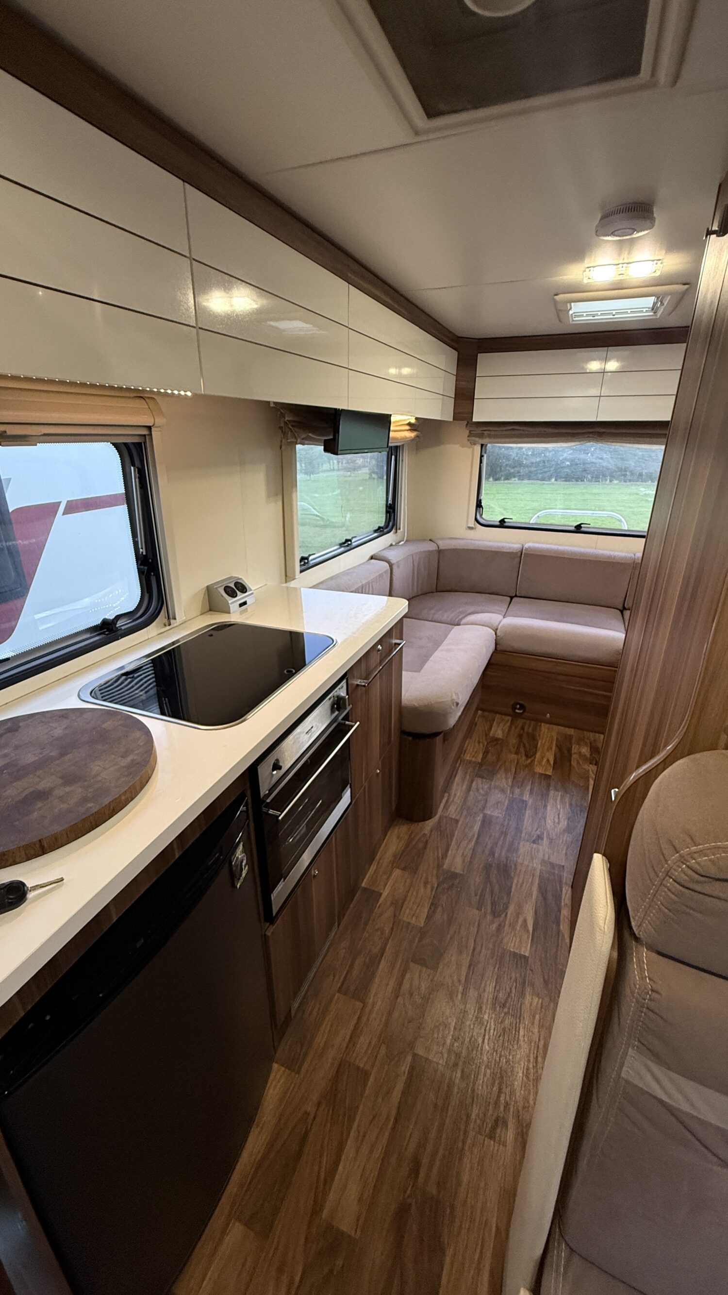 Rosy 6 berth campervan rental in New Zealand with bike rack, awning and spacious family motorhome layout.