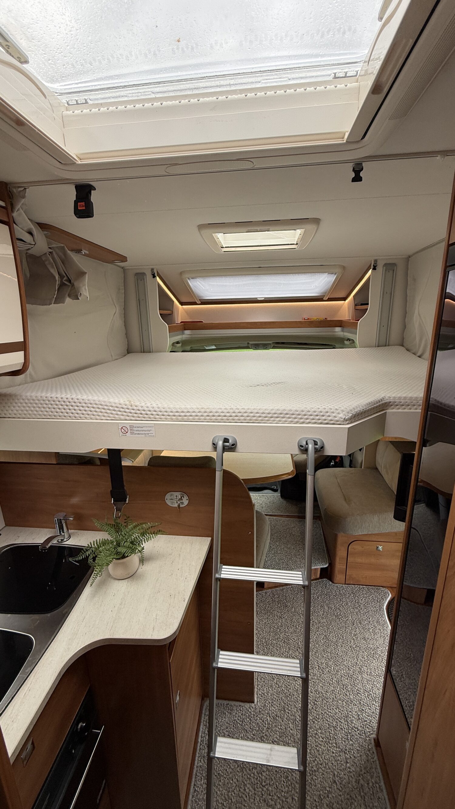Sammy 4 berth campervan rental in New Zealand with bike rack, awning and twin bed
