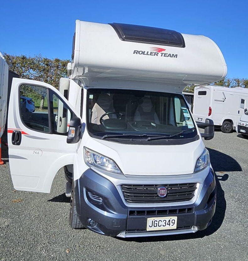 Rosy 6 berth campervan rental in New Zealand with bike rack, awning and spacious family motorhome layout.